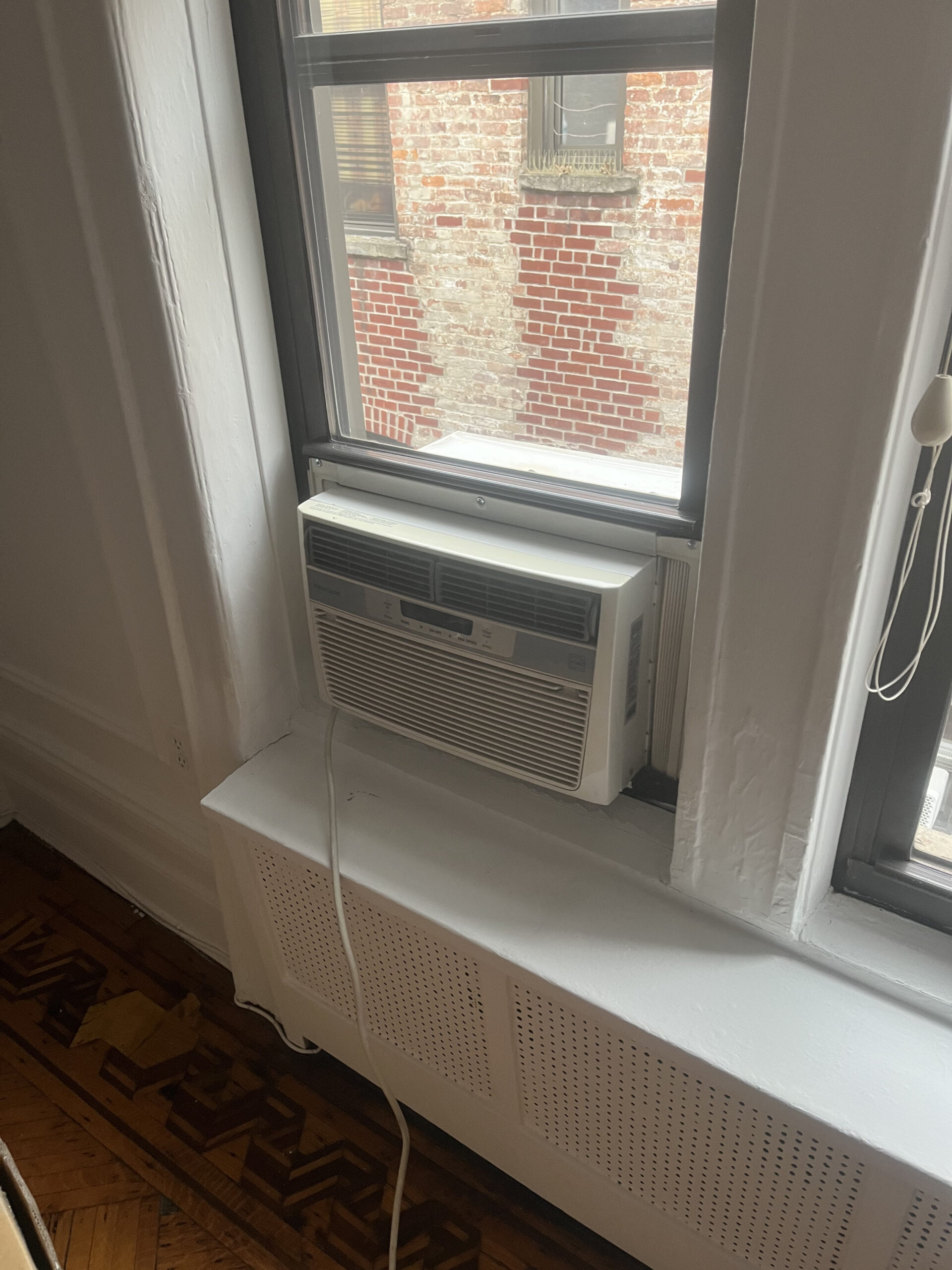 Close-up of AC installed in New Jersey window