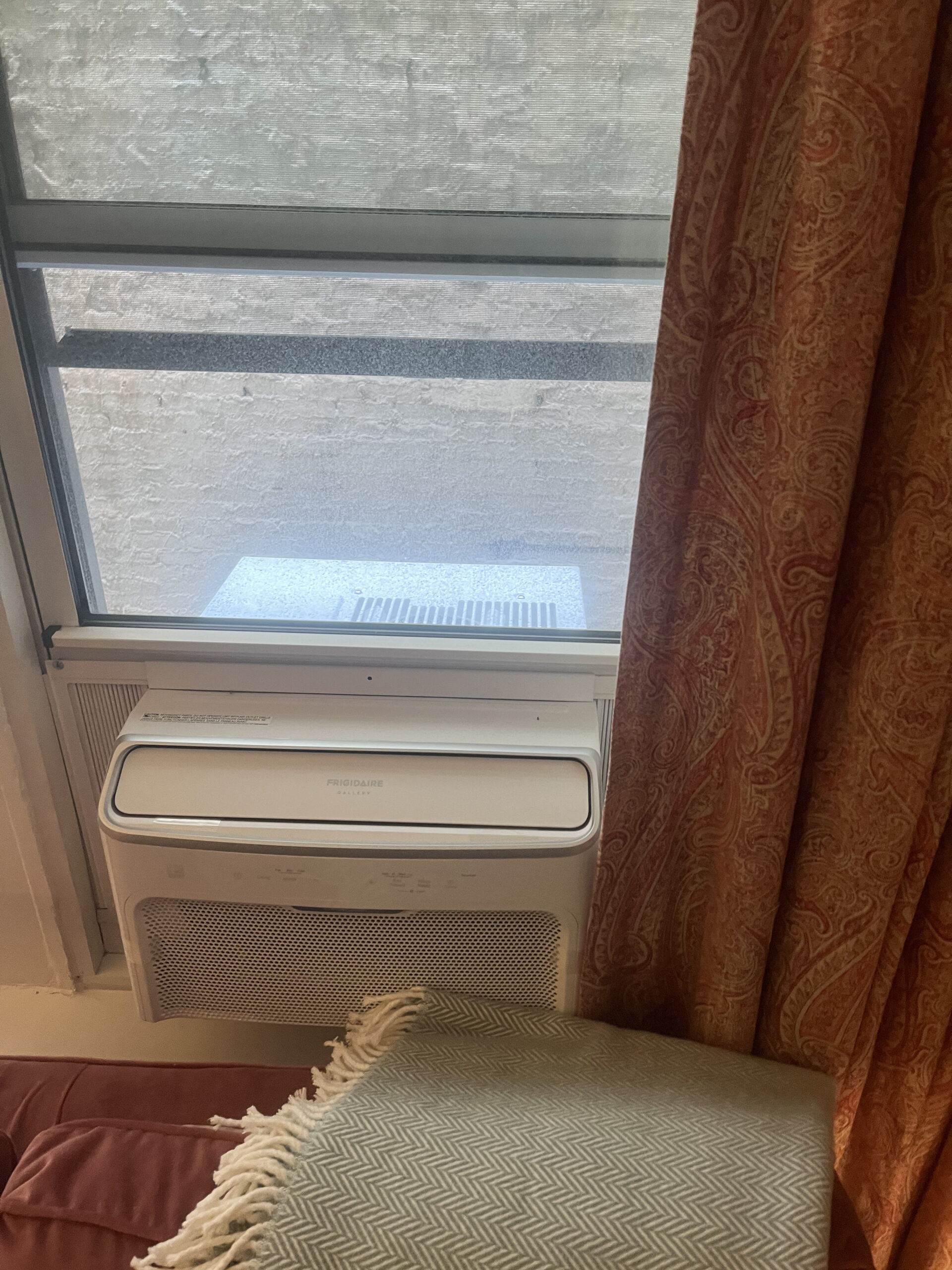 U-shape AC unit mounted in residential window