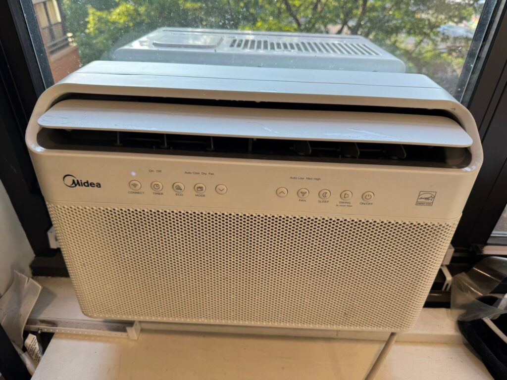 Properly installed clean window air conditioner after service in New York City