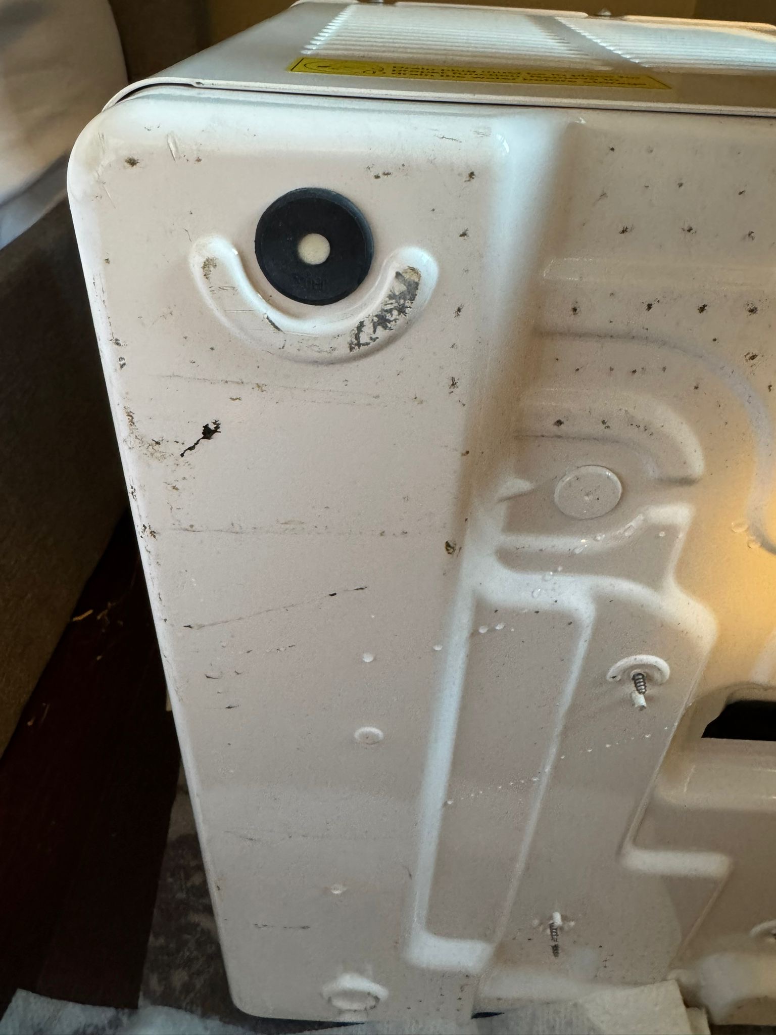 Midea U-shaped air conditioner drain plug recall fix showing drainage system detail